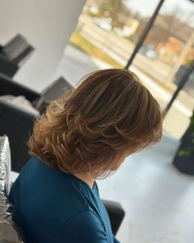 Caramel mid-length blow-dried out with plenty of bounce