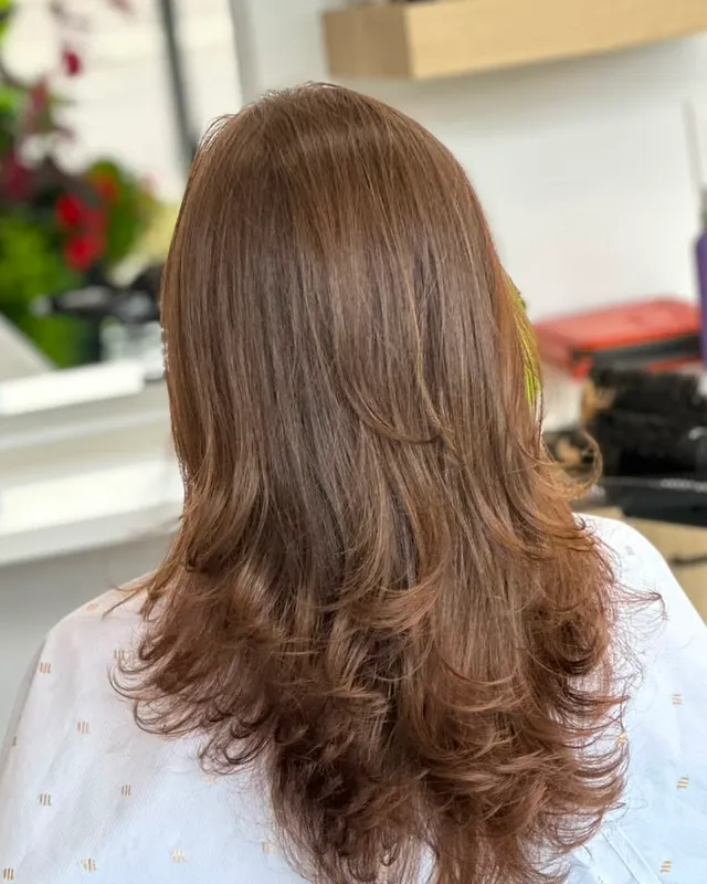 Warm copper colour cut into long layers and curled out