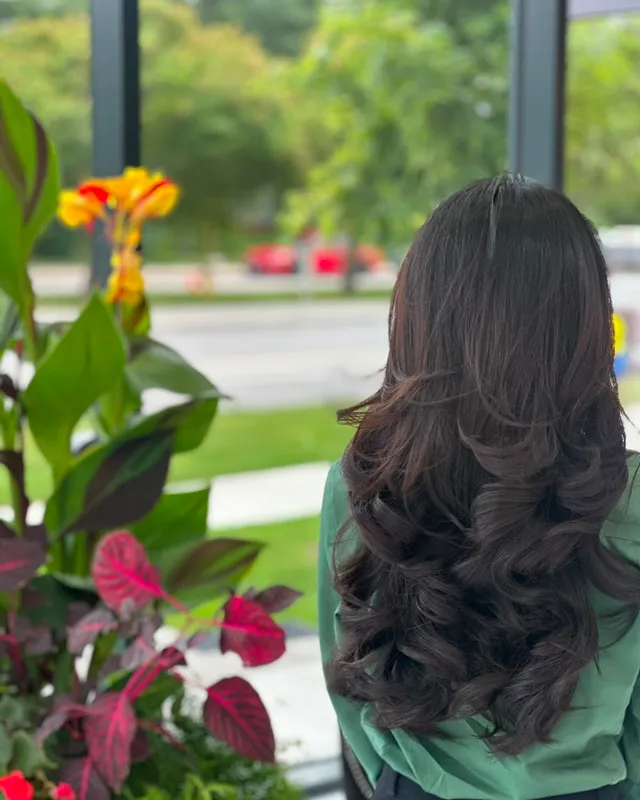 Deep curls set into long dark hair
